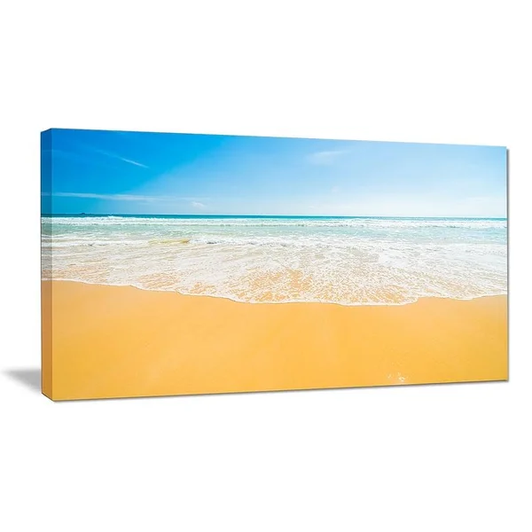 Design Art Long Waves on Sand Under Blue Sky Seashore Photographic Print on Wrapped Canvas Size: 20x22 H x 40x22 W x 1x22 D